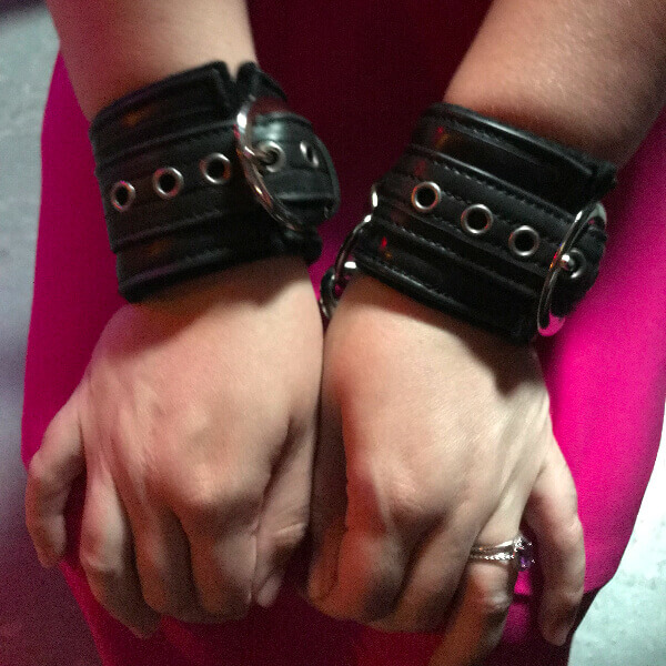 Kayla Lords wearing cuffs from Oxyd Creations