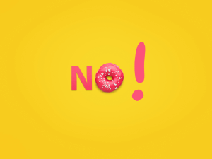 word "no" spelled with pink n, pink doughnut, and pink exclamation point over yellow background